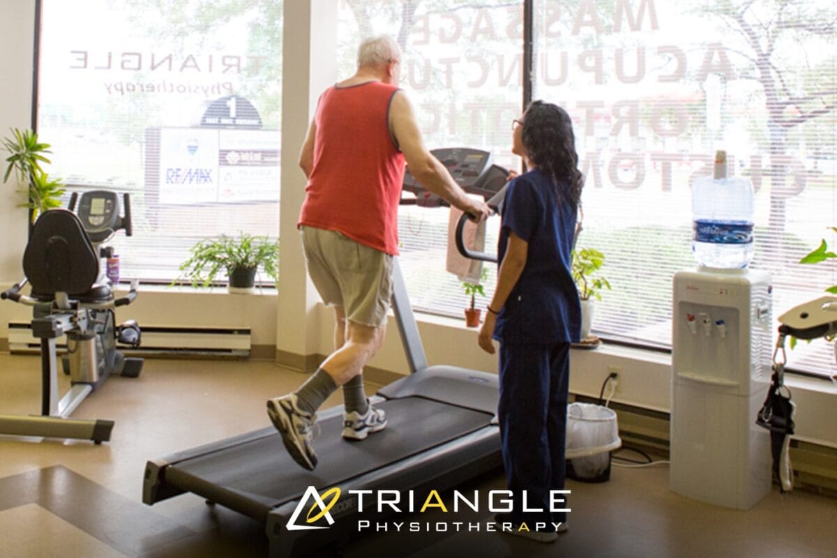 Physical therapist guiding patient through mobility assessment during first session