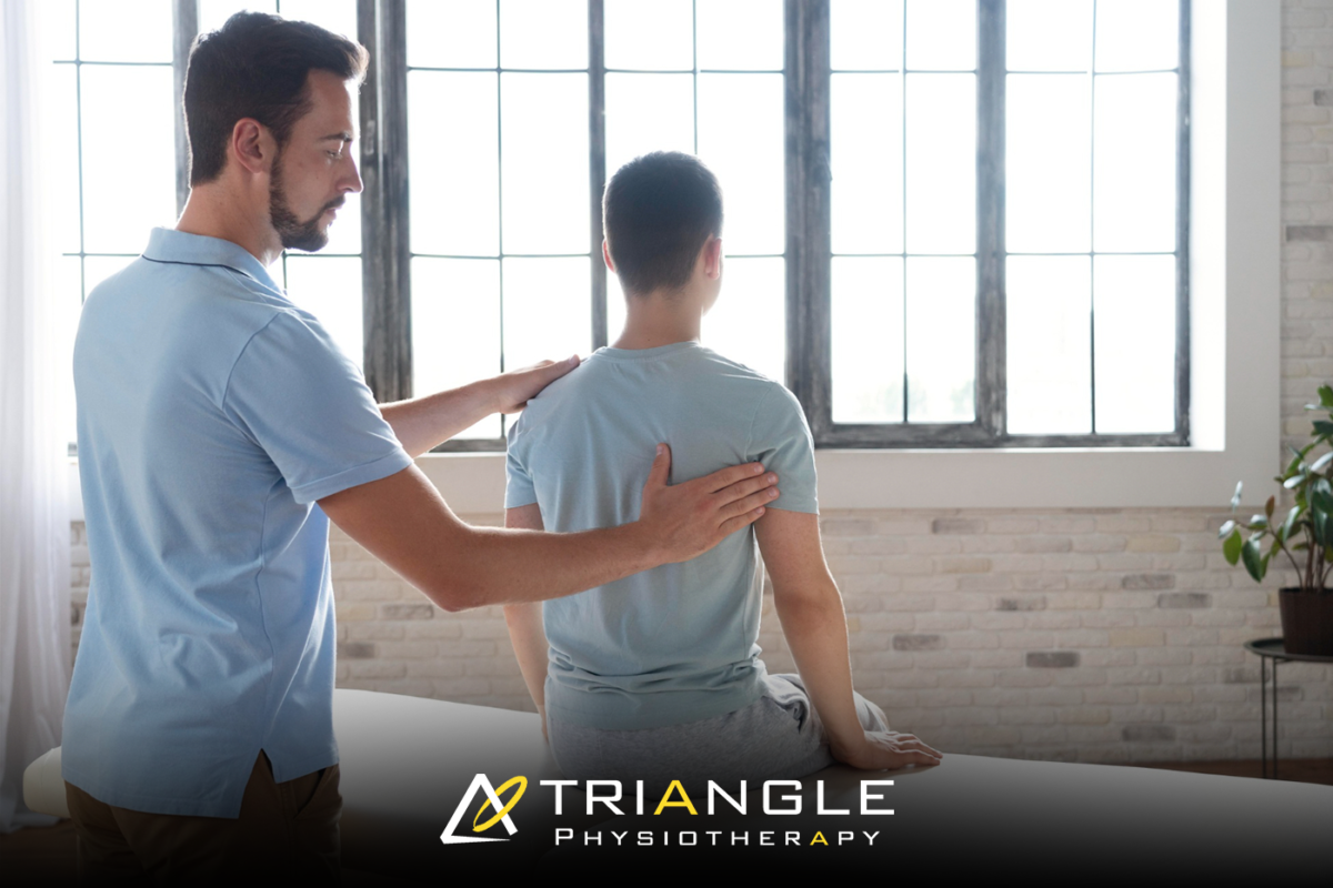 Physiotherapist providing back pain treatment at a physiotherapy clinic in North York